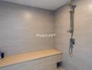 Modern bathroom with shower and built-in bench