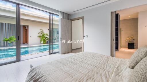 Modern bedroom with pool view