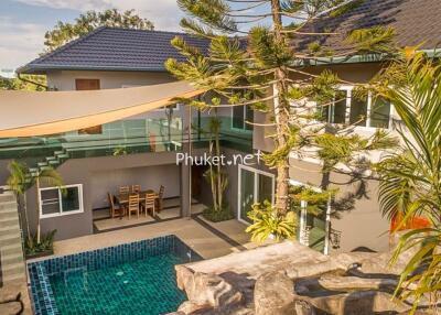 Aerial view of a luxury house with a swimming pool