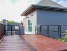 Spacious rooftop terrace with modern railings and a view