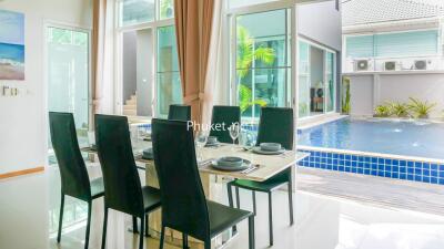 Modern dining area with pool view