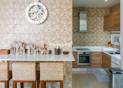 Modern kitchen with counter and bar stools