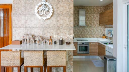 Modern kitchen with counter and bar stools