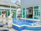 Outdoor area with swimming pool and decorative elephant fountains