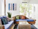 Bright living room with wicker furniture and colorful cushions