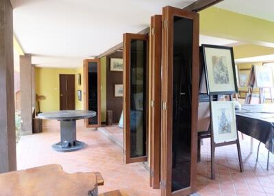 Spacious living area with art and patio door