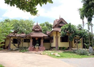 Exterior view of a large house with unique architectural features