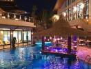 Luxurious outdoor pool area at night with bar seating