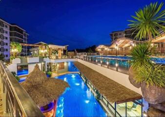 Exterior view with swimming pool and night lighting