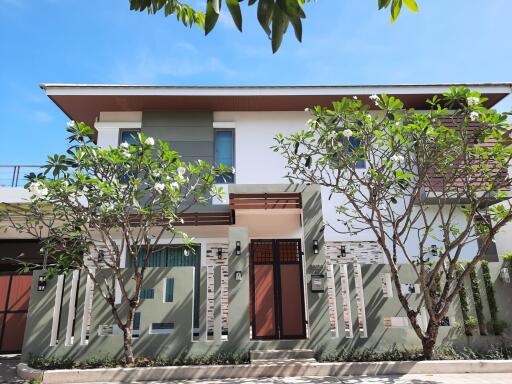 Modern two-story house with a landscaped front yard