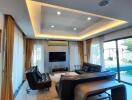 Modern living room with leather sofas and a view of the pool