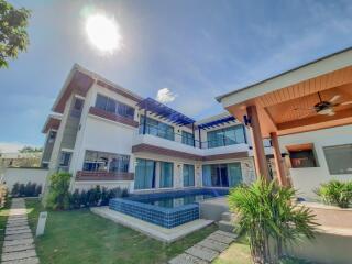 Modern two-story house with pool and garden