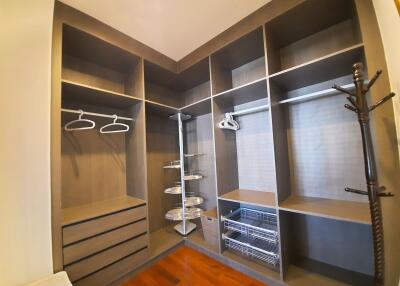 Spacious walk-in closet with shelving and hanging space