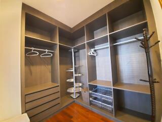 Spacious walk-in closet with shelving and hanging space