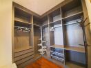 Spacious walk-in closet with shelving and hanging space