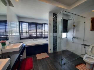 Modern bathroom with glass shower and bathtub