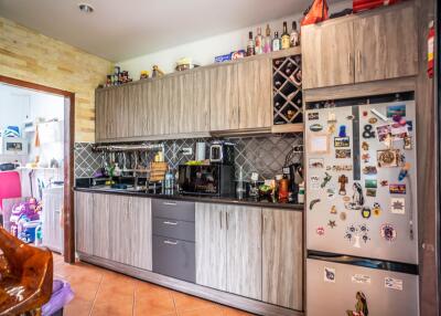 Modern kitchen with wooden cabinets and appliances