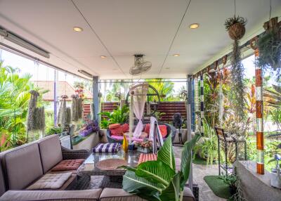 Covered patio with seating and plants