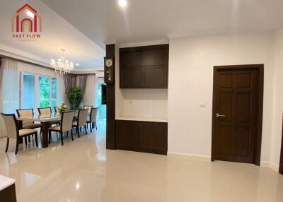 Spacious living and dining area with elegant furniture and decor