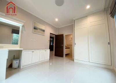 Spacious bedroom with modern built-in wardrobe and ensuite bathroom