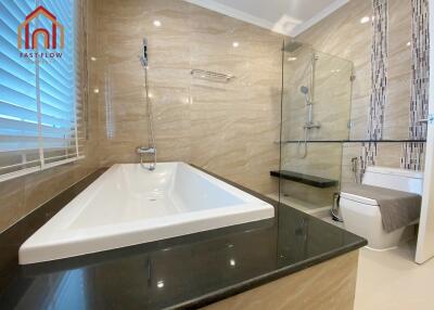 Modern bathroom with bathtub and shower area