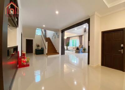 Spacious living room with staircase and modern decor