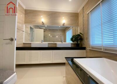 Modern bathroom with double sinks and large mirrors