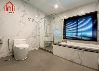 Modern bathroom with glass shower and bathtub