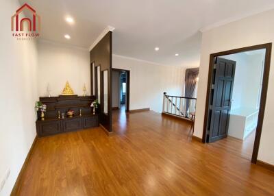 Spacious living area with wooden flooring