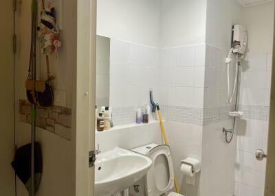 Bathroom with a shower, sink, and toilet