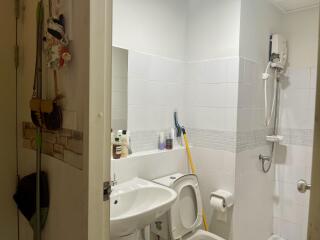 Bathroom with a shower, sink, and toilet