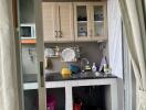 Compact kitchen with storage cabinets and counter space