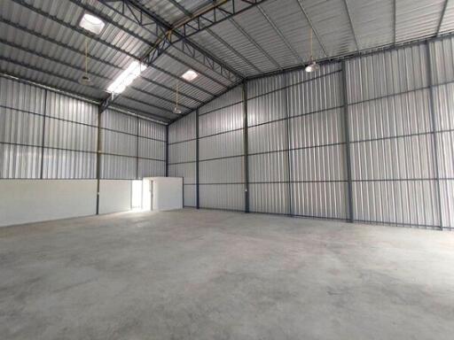 spacious industrial warehouse interior with high ceiling