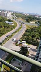 View from balcony with surrounding area and road