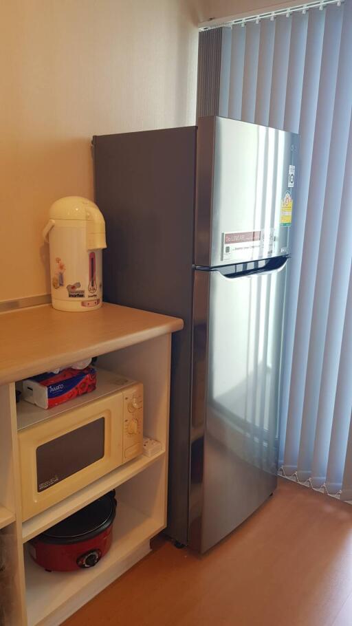 kitchen with refrigerator and microwave oven