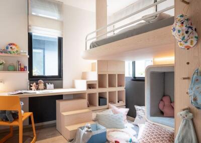 Cozy bedroom with a loft bed and study area