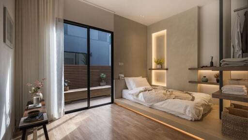 Cozy modern bedroom with built-in shelves and sliding glass door