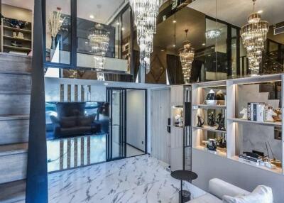 Modern living room with elegant chandelier and mezzanine