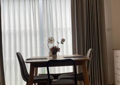 Modern dining area with wooden table and chairs