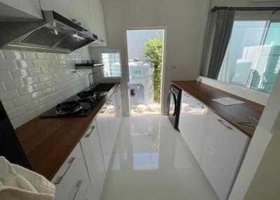 Modern kitchen with sleek cabinets and appliances