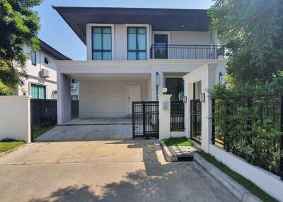 Modern two-story house with a garage and driveway