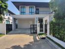 Modern two-story house with a garage and driveway