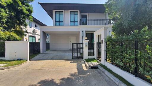 Modern two-story house with a garage and driveway