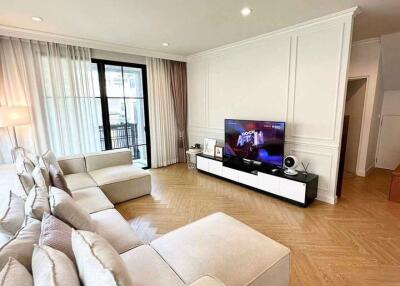 Spacious living room with modern furniture and entertainment center