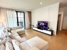 Spacious living room with modern furniture and entertainment center