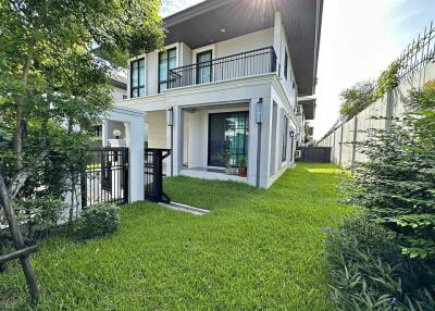 Modern two-story house with a well-maintained garden