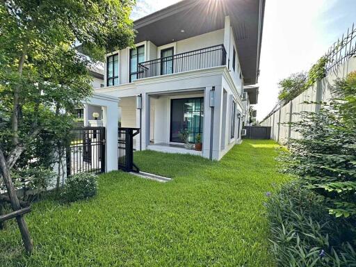 Modern two-story house with a well-maintained garden