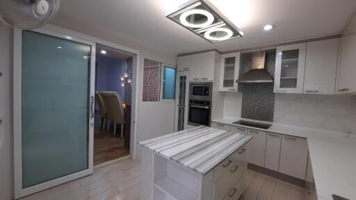 Modern kitchen with island and recessed lighting