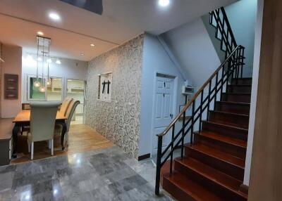 Elegant dining area with stairs