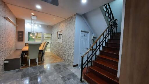 Elegant dining area with stairs